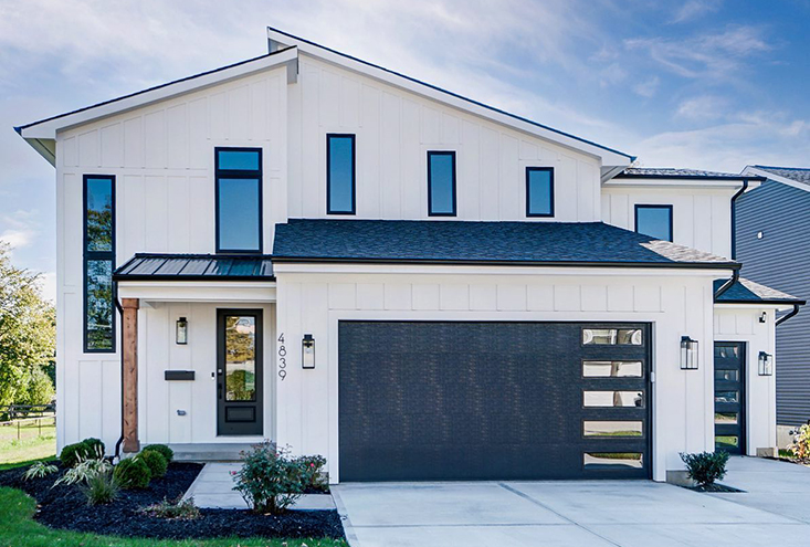 Modern white exterior with lutron lighting, home wifi, and security.